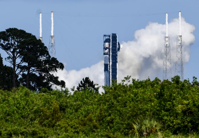 A SpaceX Falcon 9 rocket fires its engines, but liftoff from the Cape Canaveral Space Force Station was aborted Friday.